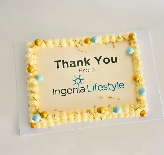 rectangle cake with corporate logo and designed to match the colour scheme