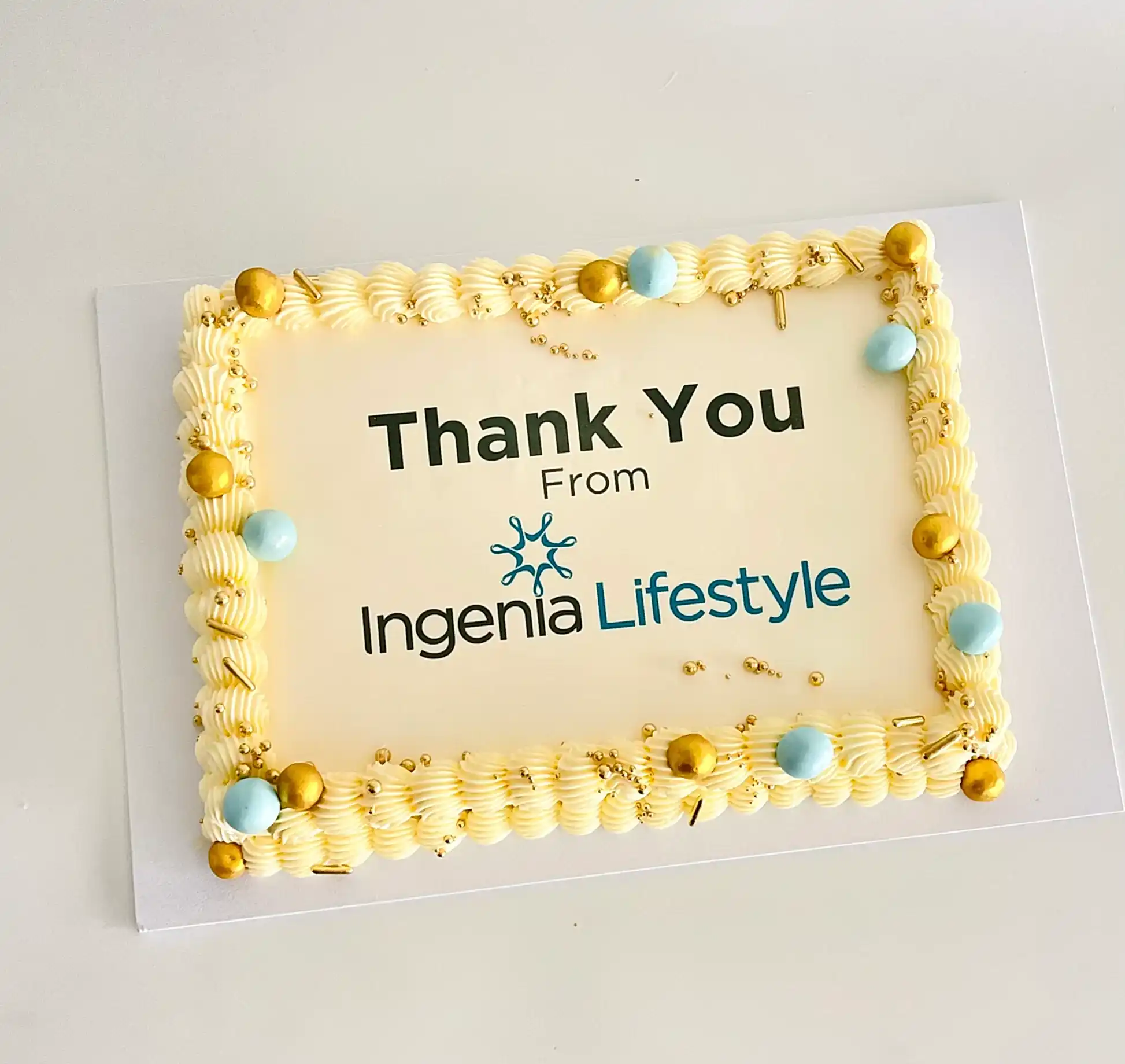 rectangle cake with corporate logo and designed to match the colour scheme