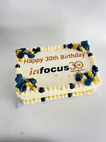 rectangle cake with office logo, message and matching decorations